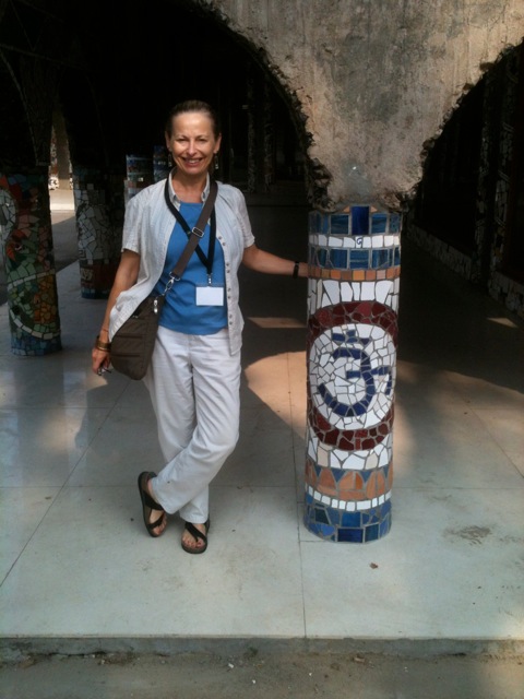 Cathy Amos with mosaic pillar in Phase 3 of Rock Garden